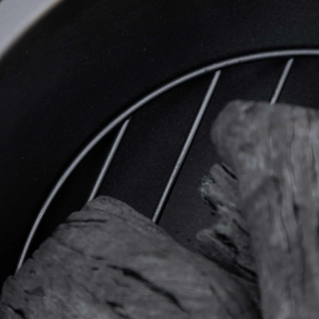 Light brown 24-inch metal outdoor fire pit with spark cover and poker for patio and backyard use