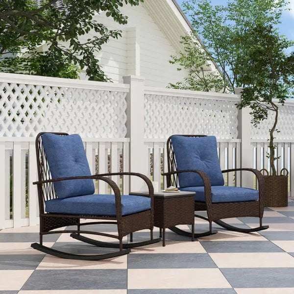 Outdoor rattan chaise lounge set with blue cushions and wicker frame on patio