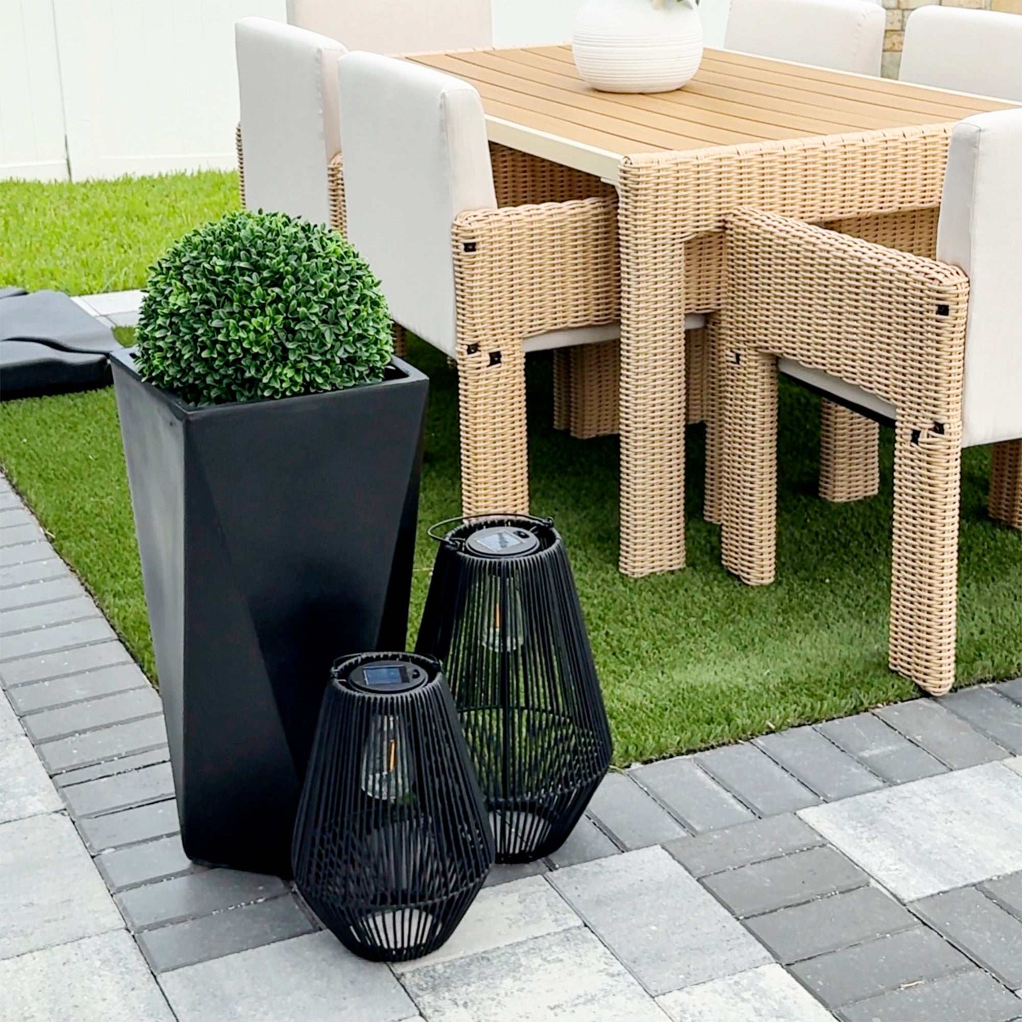 Set of 3 black indoor outdoor planters made of durable magnesium oxide with drainage holes and stackable tall geometric design