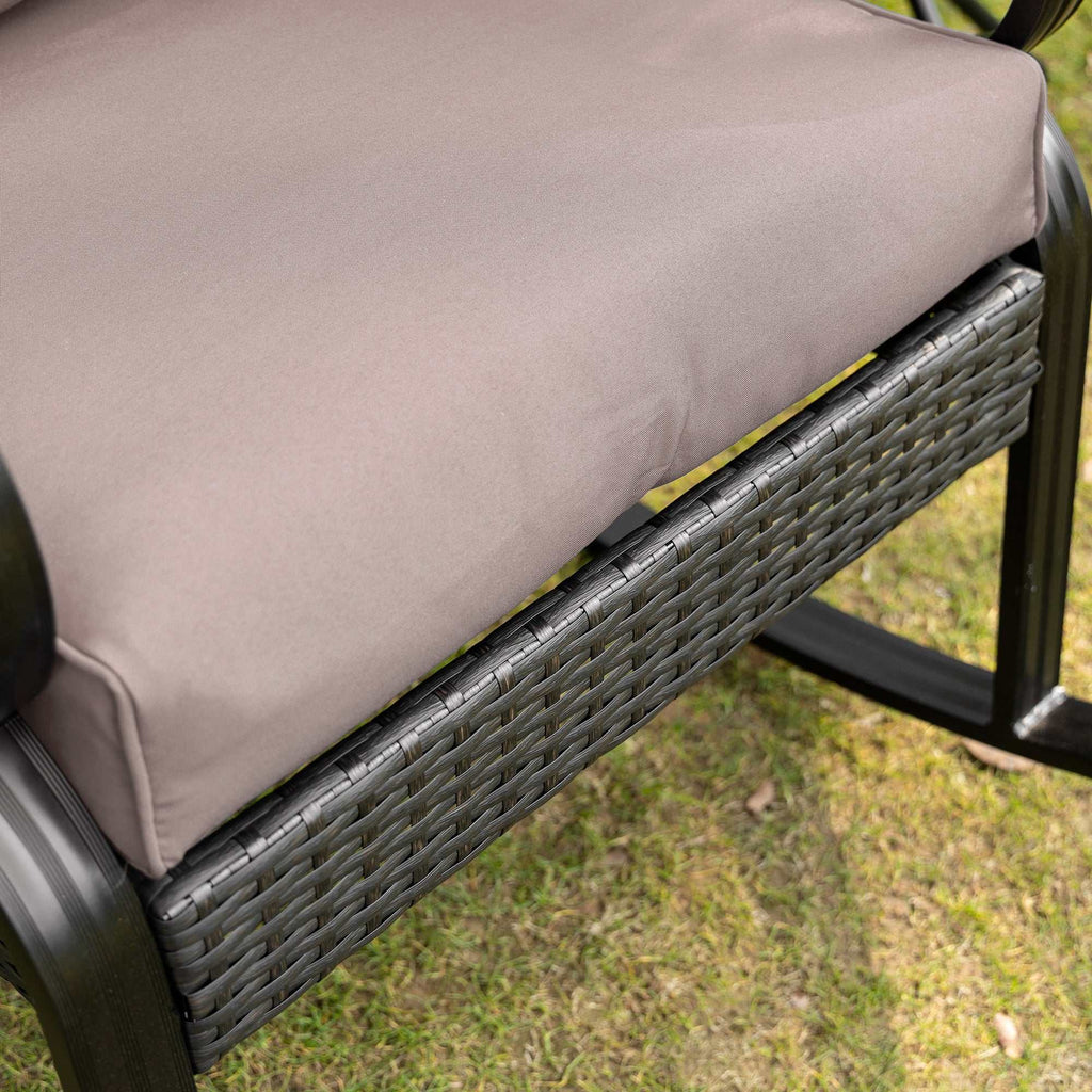 Gray outdoor wicker rocking chair with padded cushions and aluminum frame for patio and garden use