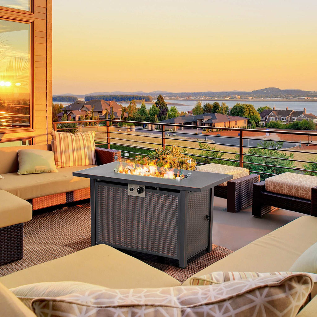 43 inch outdoor propane gas fire pit table with bronze wicker-effect steel base, glass wind guard, and blue fire beads