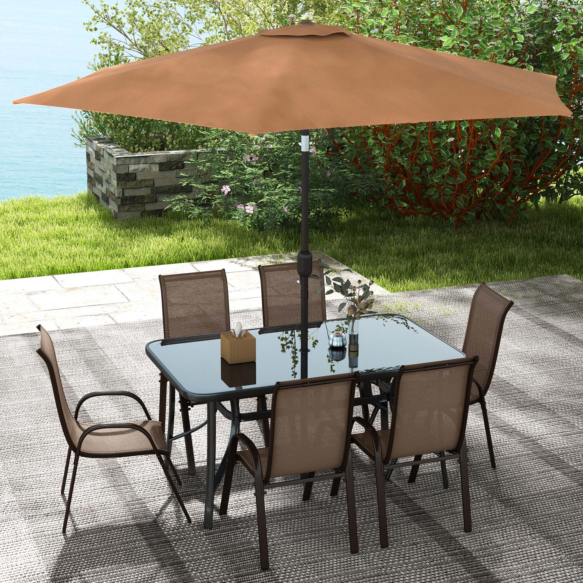 Light mixed brown 8-piece patio furniture set with glass dining table, six mesh chairs, and 9ft adjustable umbrella outdoors