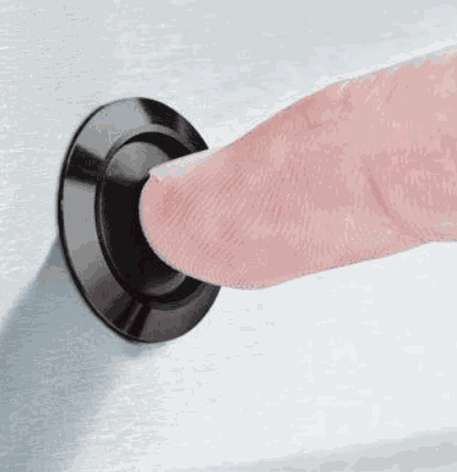 Close-up of finger pressing control button on Broil King CROWN 520 with professional-grade performance