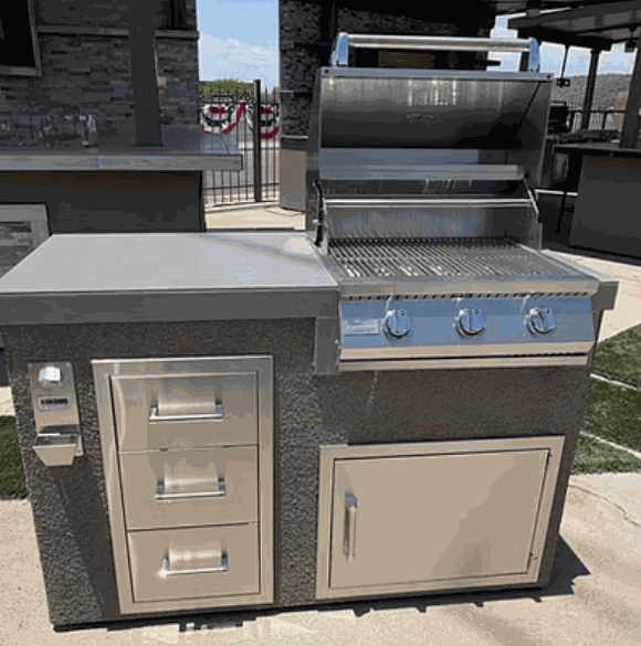 Kokomo Grills 5' BBQ Island with 3-burner stainless steel grill and triple storage drawers in a compact outdoor cooking station.