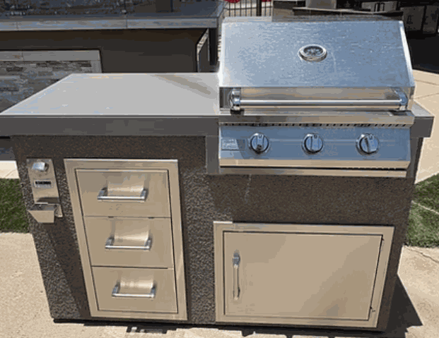 Kokomo Grills 5' BBQ Island with 3-burner grill and triple storage drawers in outdoor kitchen setup