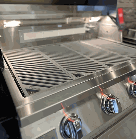 LuxCut Laser Cut Culinary Grates made of 304 stainless steel on a multi-burner grill for precise heat distribution and durability.