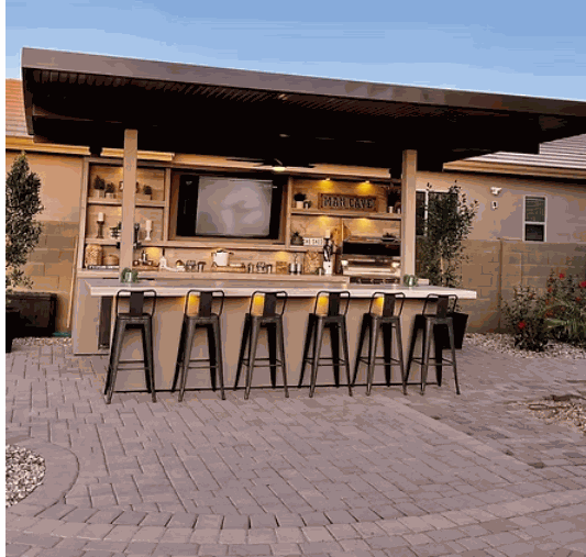 Outdoor Fantasy Island 20'x20' backyard kitchen with 70" TV, bar seating, aluminum roof, and professional 5-burner Kokomo grill