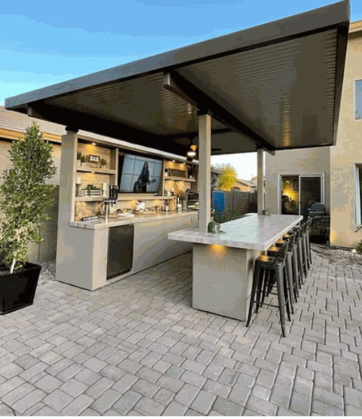 Outdoor Fantasy Island 20'x20' kitchen with 70" TV, bar seating, aluminum roof, professional Kokomo grill, and outdoor kegerator
