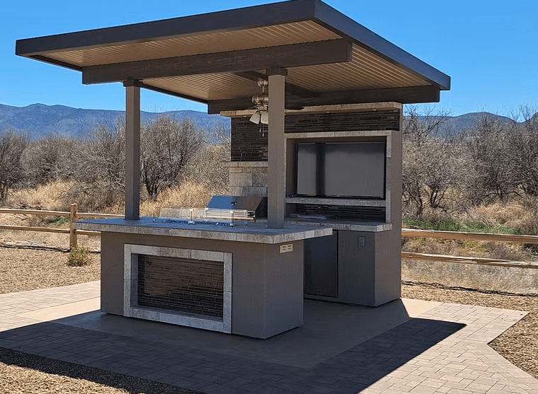 Baja Outdoor Kitchen Island with BBQ grill, outdoor TV, patio cover, bar seating, and storage drawers