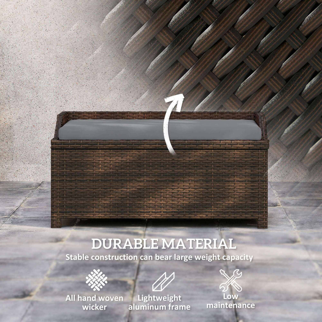 Gray cushioned outdoor wicker storage bench with hidden compartment and dark brown rattan frame