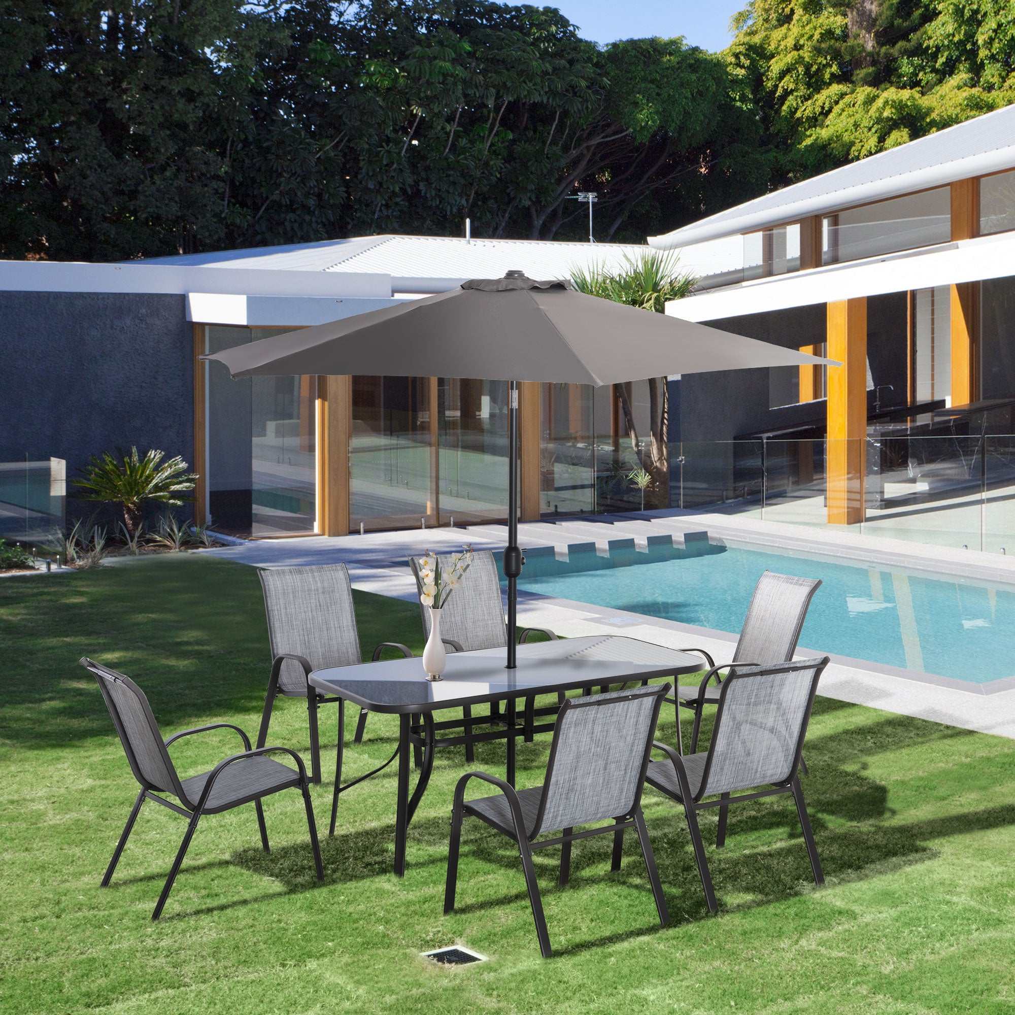8-piece gray patio furniture set with 6 mesh chairs, tempered glass table, and 9ft push-button tilt umbrella for outdoor dining