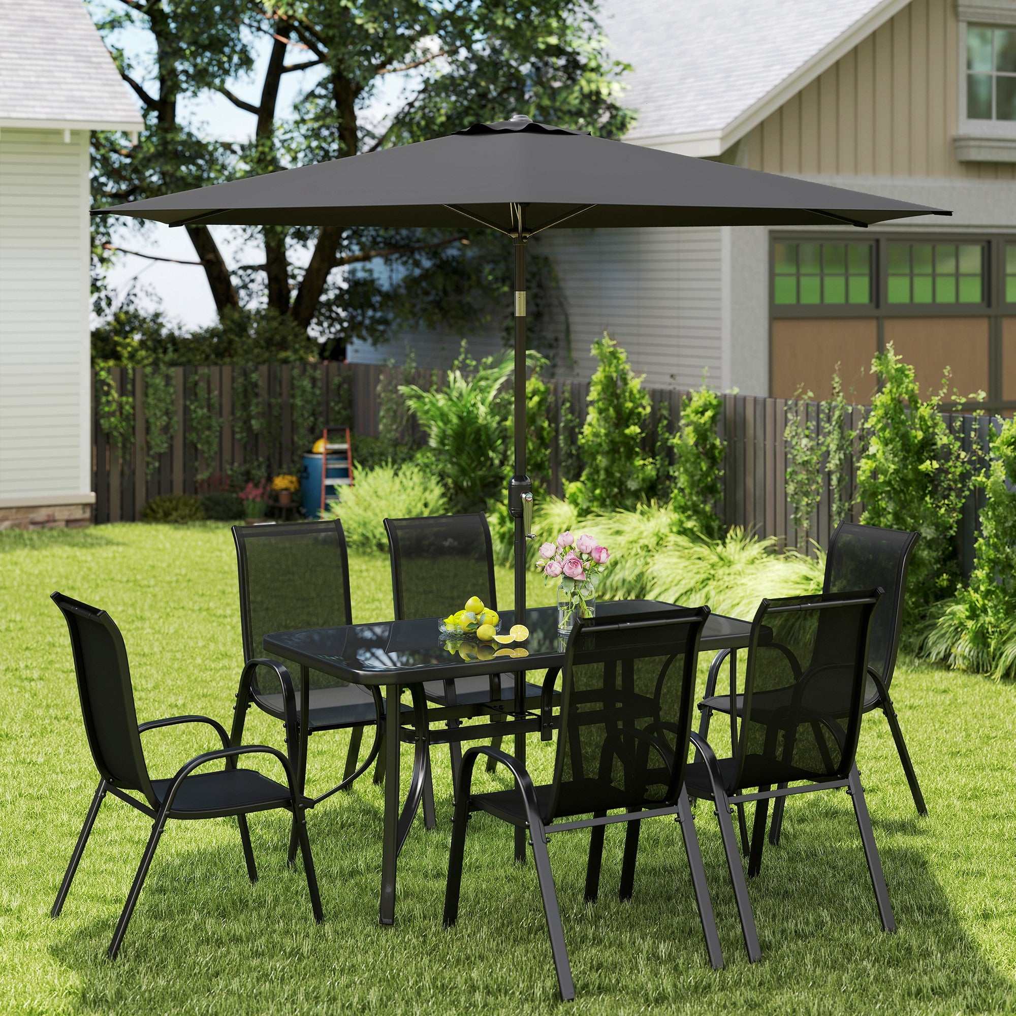 Black 8-piece patio furniture set with glass dining table, six mesh chairs, and 9ft umbrella in backyard setting