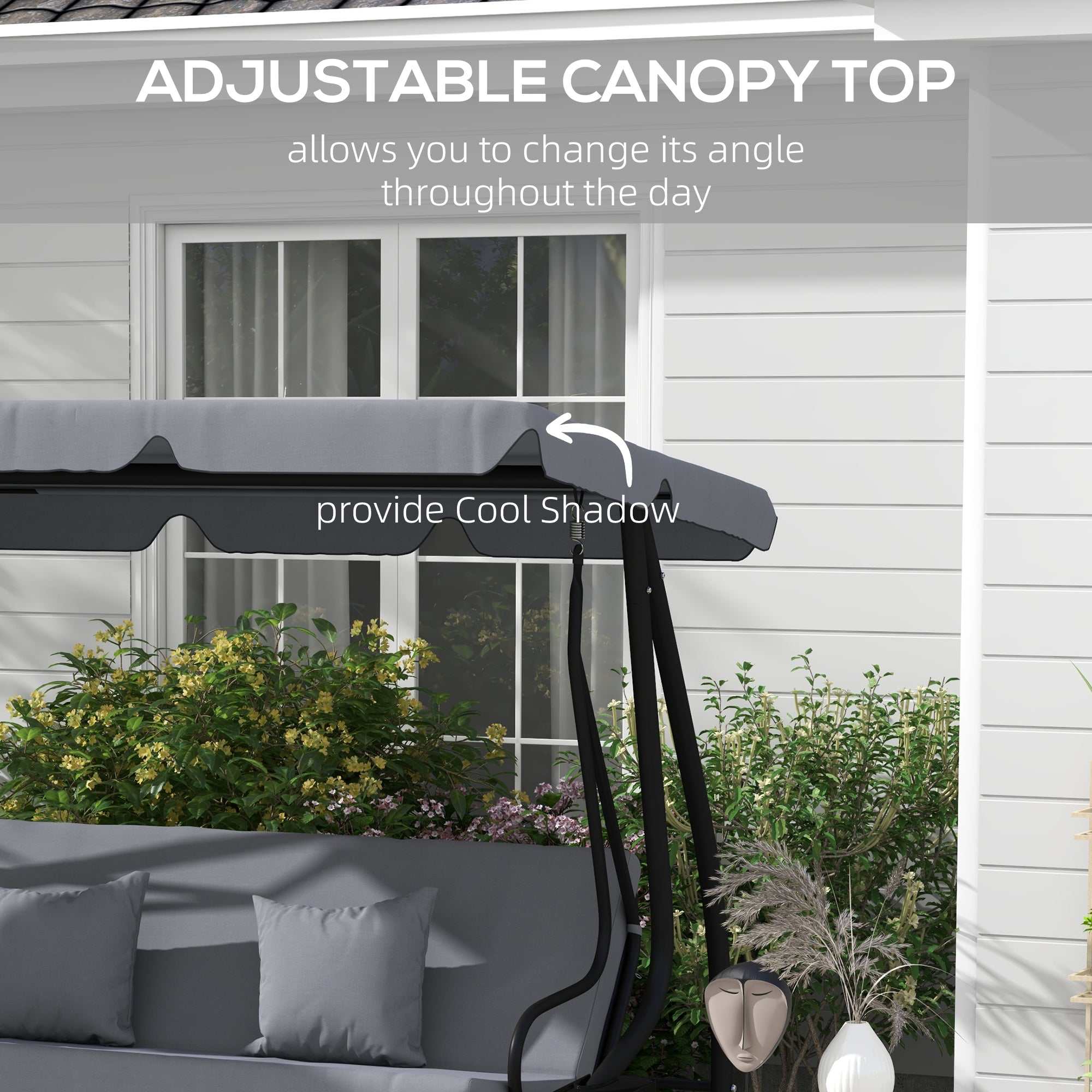 Dark gray free standing swing bench with adjustable canopy, cushions, pillows, and steel frame