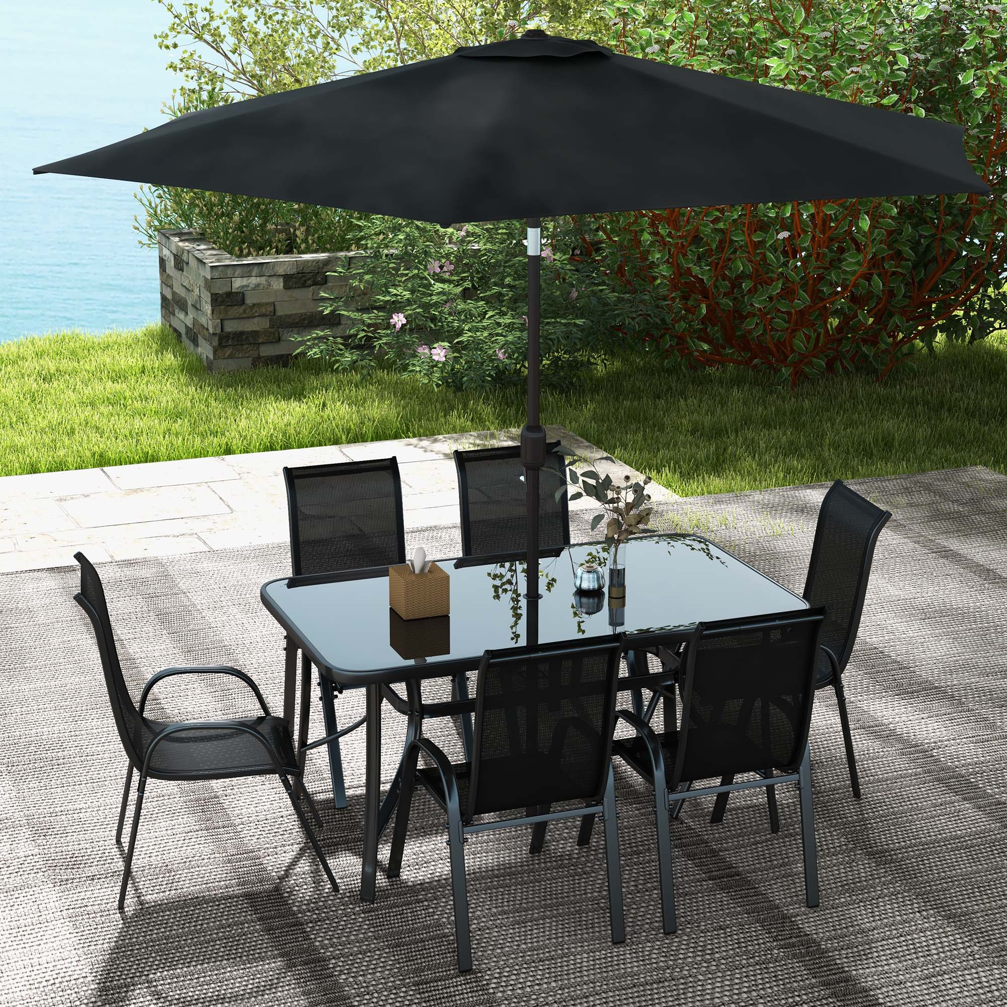8-piece black outdoor dining set with glass table, 6 mesh chairs, and 9ft tilt umbrella on patio